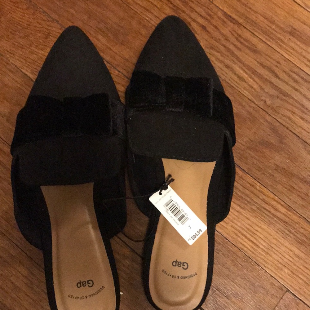 Black mules with velvet bows